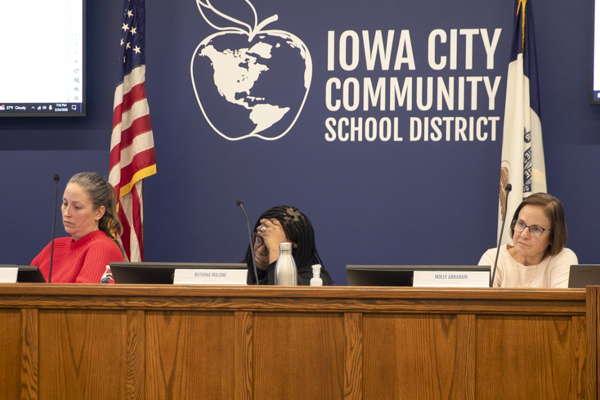 (From left to right) School board members Lisa Williams, Ruthina Malone, and Molly Abraham listen to options for budget cutting on Tuesday, Feb. 24, 2026 in the District Educational Services Center in Iowa City, Iowa. The board discussed strategies to cut $6 million from the annual budget. (Annika Nelson/The Daily Iowan)