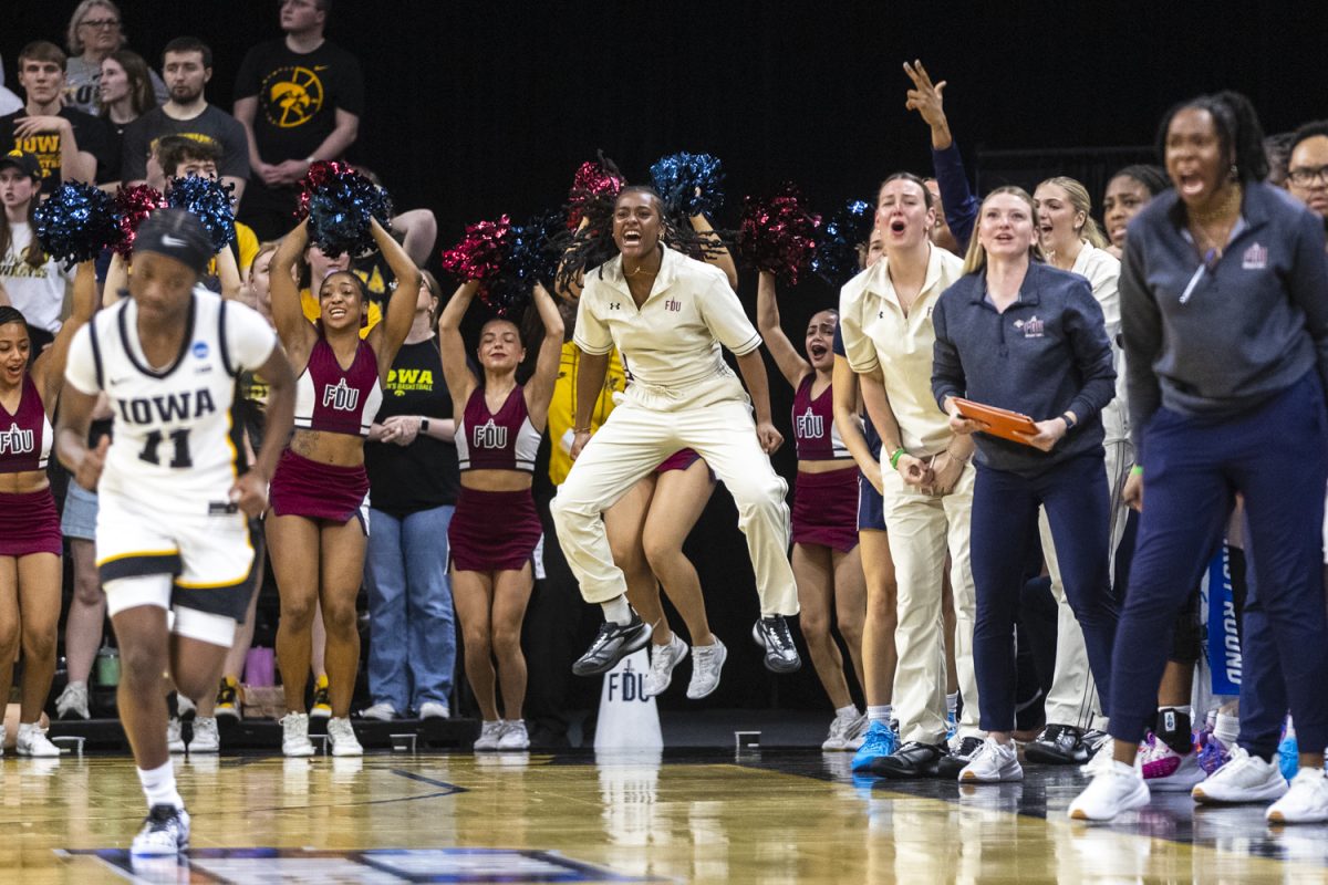The Fairleigh Dickinson Knights cheer squad and bench react after an FDU score during a basketball game between the No. 2 seed Iowa Hawkeyes and the No. 15 seed Fairleigh Dickinson Knights at Carver-Hawkeye Arena in Iowa City, Iowa, on Saturday, March 21, 2026. The Hawkeyes defeated the Knights, 58-48.