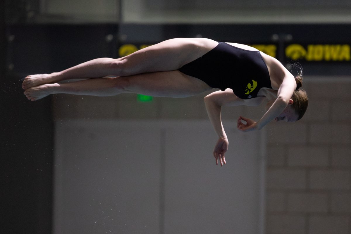 Freshman diver Zita Bernatsky twists into her dive during Iowa’s swimming and diving meet against St. Thomas on January 30, 2026 at the Campus Recreation and Wellness Center. Iowa won the meet 182-42 after honoring seven seniors.