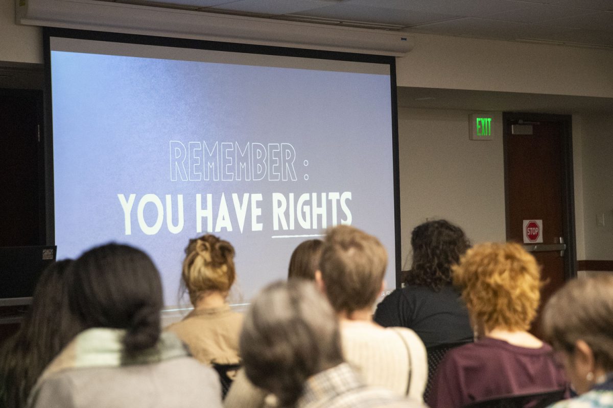 Attendees watch a video during a Know Your Rights Training at the Coralville Public Library in Coralville on Friday, February 27, 2026. The training was targeted towards nonprofits and volunteers who may have encounters with ICE.  (Isabella Tisdale/The Daily Iowan)