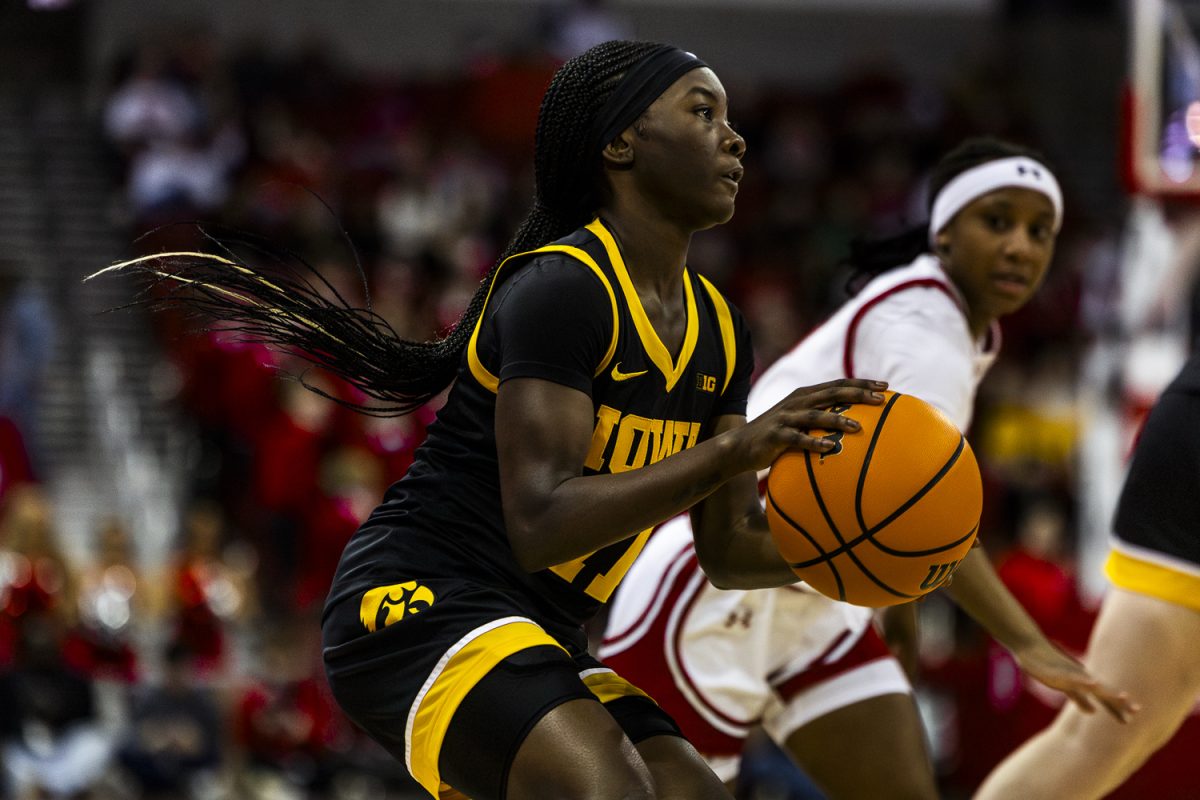 Iowa guard Chazadi Wright pulls up for three pointer during a basketball game between the No. 9 Iowa Hawkeyes and the Wisconsin Badgers at the Kohl Center in Madison Wisconsin on Sunday, Mar. 1, 2026. Wright had 14 points and 4-7 from the three point line. The Hawkeyes defeated the Badgers, 81-52. (Reece Schrader/The Daily Iowan)