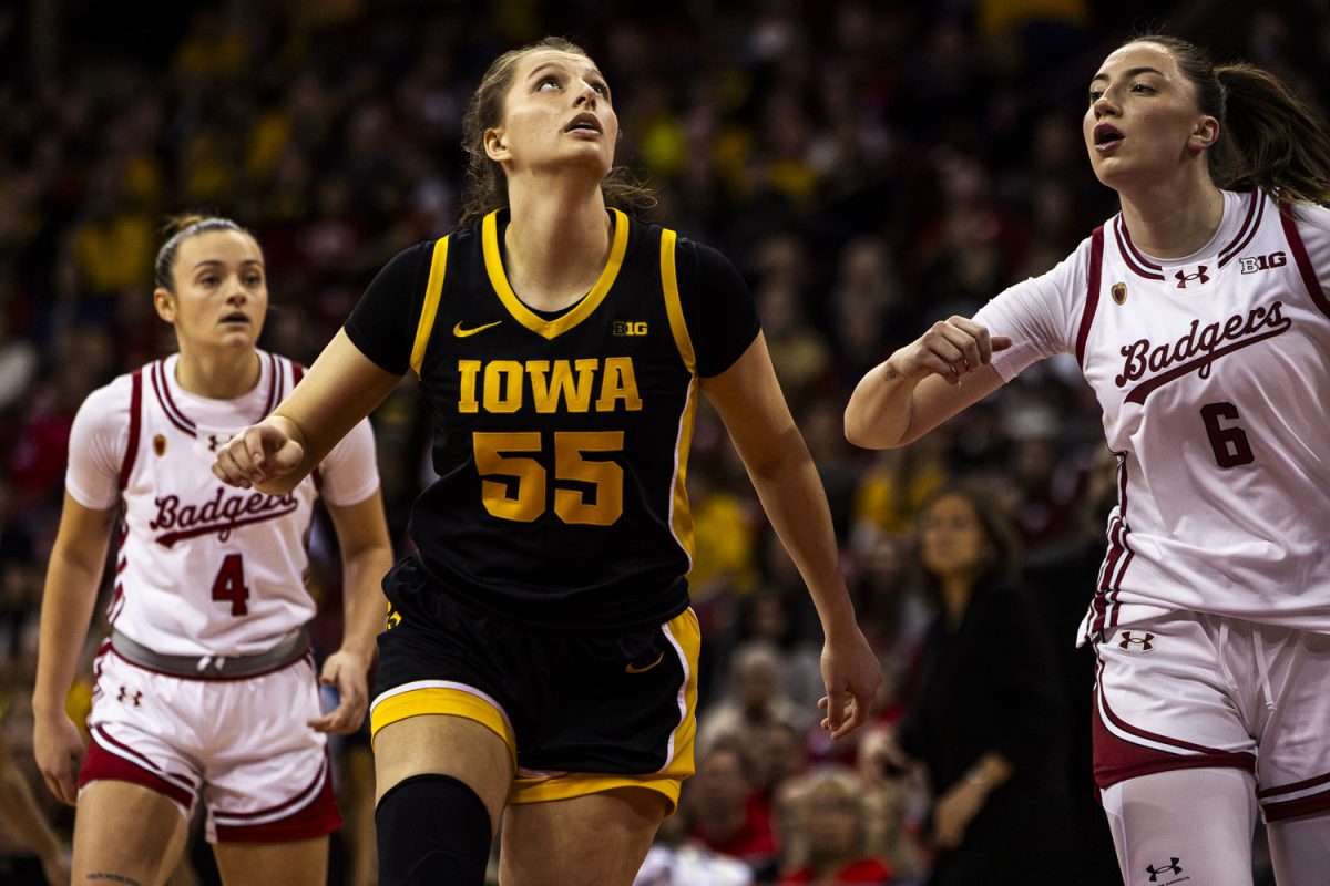 Iowa guard Teagan Mallegni looks for rebound during a basketball game between the No. 9 Iowa Hawkeyes and the Wisconsin Badgers at the Kohl Center in Madison Wisconsin on Sunday, Mar. 1, 2026. Mallegni secured 10 points and two rebounds for the Hawkeyes. The Hawkeyes defeated the Badgers, 81-52.  (Reece Schrader/The Daily Iowan)