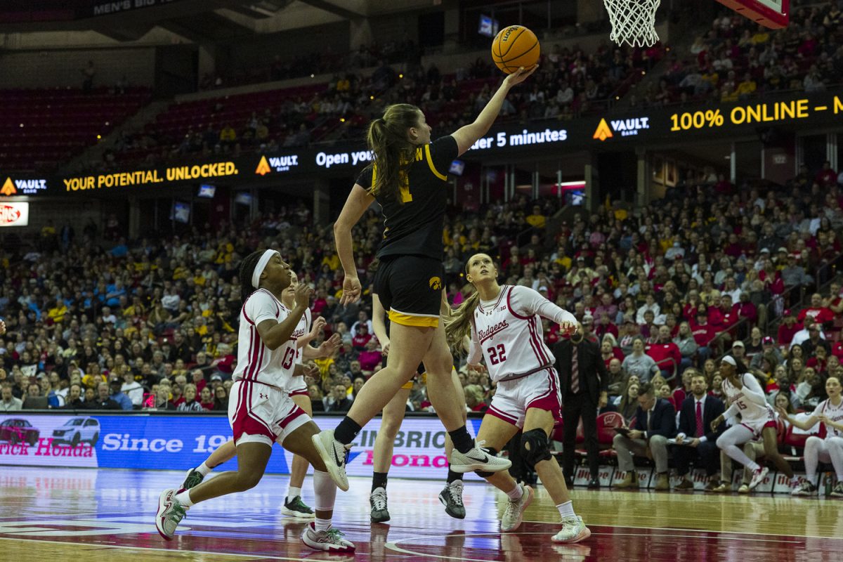 Iowa guard Taylor Stremlow, finishes lay up during a basketball game between the No. 9 Iowa Hawkeyes and the Wisconsin Badgers at the Kohl Center in Madison Wisconsin on Sunday, Mar. 1, 2026. The Hawkeyes lead over the Badgers, 33-29, in the conclusion of the first half.  (Reece Schrader/The Daily Iowan)