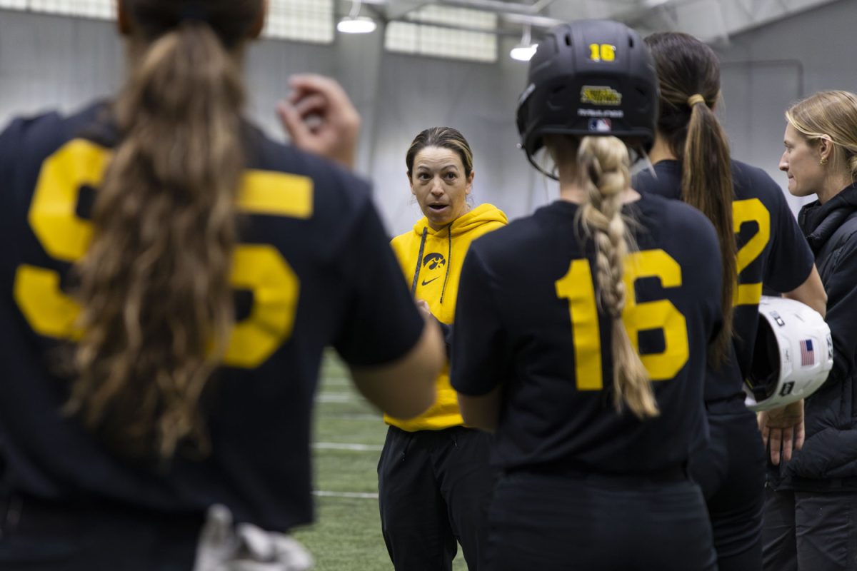 Iowa softball head coach Stacy May-Johnson speaks with the players during a practice in the Hawkeye Tennis &amp; Recreation Complex in Iowa City, Iowa on Friday, March 6, 2026. This is May-Johnson’s first year as head coach for the Hawkeyes. (Samantha DeFily/The Daily Iowan)