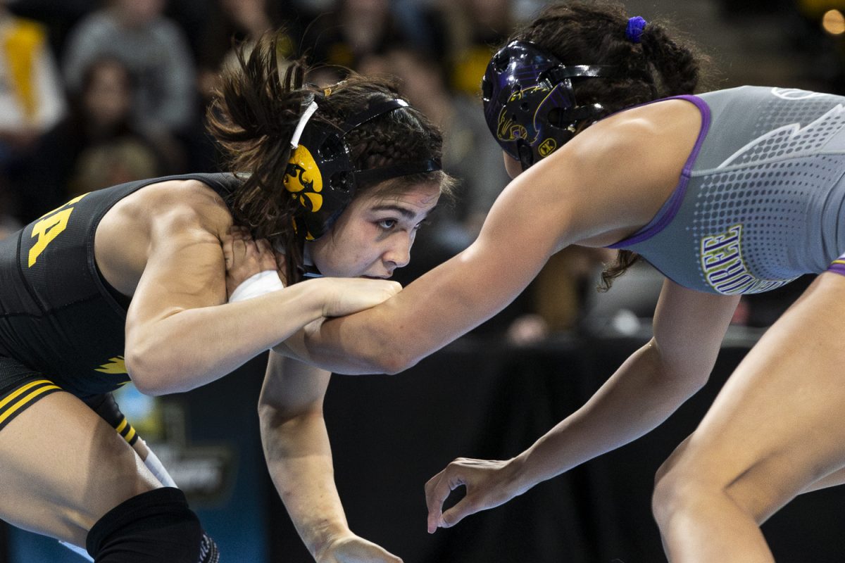 Iowa No.5 110-pound Nyla Valencia wrestles McKendree No.4 110-pound Gabriele Tedesco during the Championship Quarterfinals of the 2026 NCAA Women's National Championships at Xtream Arena in Coralville, IA, on Friday, March, 6, 2026. Valencia defeated Tedesco in a 4-4 decision. Seven of the nine Hawkeyes advanced to the Championship Semifinals. McKendree leads the tournament with 94 points, while Iowa sits in second place with 91.5. (Ethan McLaughlin/ The Daily Iowan)