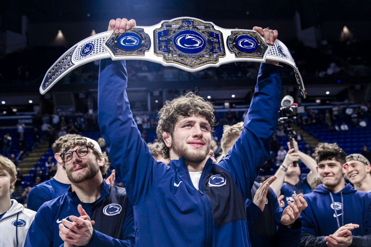 Penn State 174-pounder Levi Haines lifts up championship belt at the conclusion of the Big Ten Championships at the Bryce Jordan Center in State College, Pennsylvania on Sunday, March 8, 2026. Penn State had seven champions crowned in the finals and broke the record for most team points scored since 1995.  (Reece Schrader/The Daily Iowan)