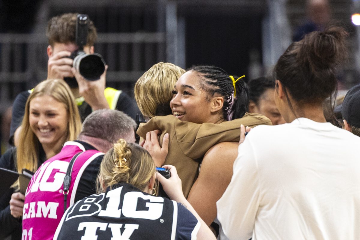 Iowa forward Hannah Stuelke hugs Iowa head coach Jan Jensen after a basketball game between Iowa and Michigan at the Big Ten Women’s Basketball Tournament at Gainbridge Fieldhouse in Indianapolis on Saturday, March 7, 2026.