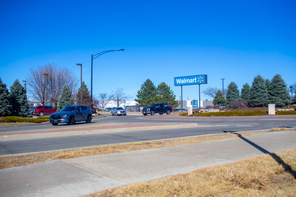 Cars driving through a roundabout on Commerce Drive and Heartland Drive in Coralville, Iowa on Saturday, March 8, 2026. Coralville plans to build a roundabout near Costco in hopes to decrease the high rate of car crashes that occur at the intersection. (Sarah Hughes / The Daily Iowan)