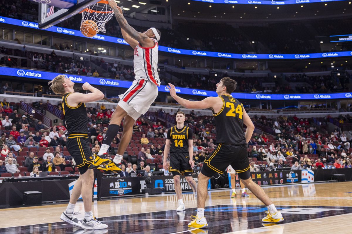 The Hawkeye defense watches an Ohio State player dunk during a basketball game between the No. 9 seed Iowa Hawkeyes and the No. 8 seed Ohio State Buckeyes at the United Center in Chicago, Illinois on Thursday, March 12, 2026. The Buckeyes defeated the Hawkeyes, 72-69. (Samantha DeFily/The Daily Iowan)