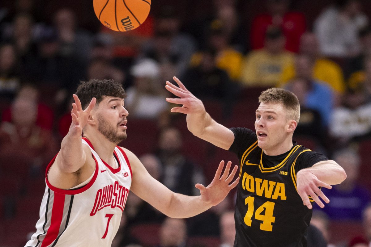 Iowa guard Bennett Stirtz passes the ball during a basketball game between the No. 9 seed Iowa Hawkeyes and the No. 8 seed Ohio State Buckeyes at the United Center in Chicago, Illinois on Thursday, March 12, 2026. The Buckeyes defeated the Hawkeyes, 72-69.