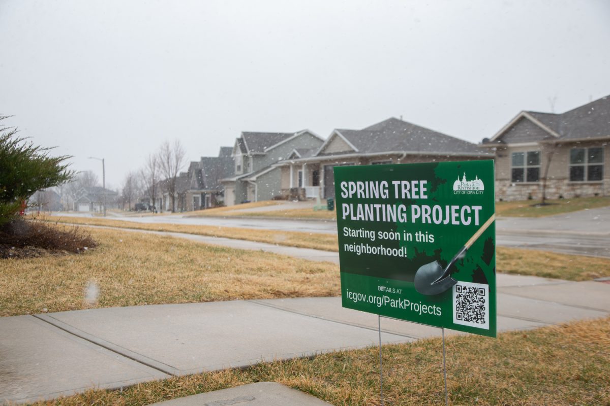 Signs are seen in a west side neighborhood in Iowa City, Iowa on Wednesday, March 11, 2026. The Spring Tree Planting Project will begin later in the spring. (Sal Yang/The Daily Iowan)