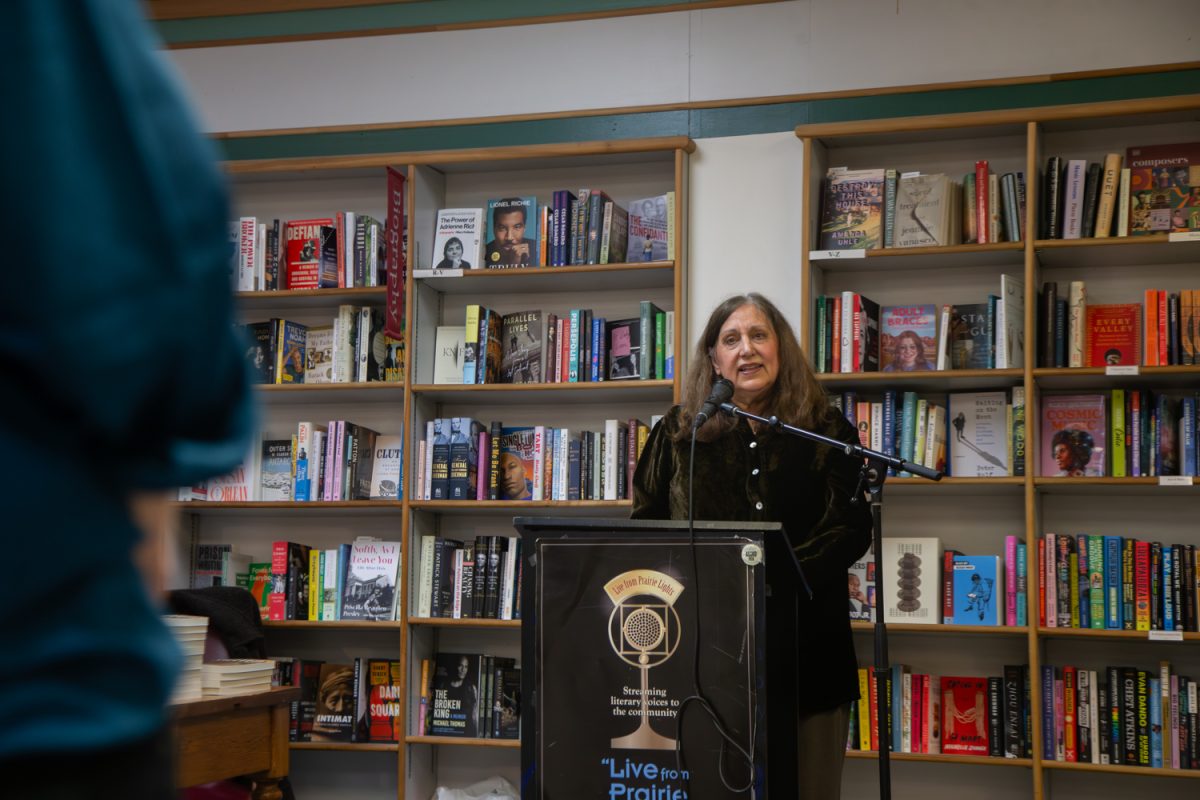 Lisa Avelleyra explains why she liked reading the dialogues out loud when she was writing Shelved, her new book, at Prairie Lights Books, in Iowa City, Iowa, on Thursday, March 12, 2026. Shelved is a murder mystery that is set in a bookstore. (Sal Yang/The Daily Iowan)