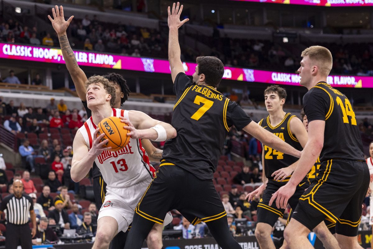 Ohio center Christoph Tilly attempts to get past the Iowa defense during a basketball game between the No. 9 seed Iowa Hawkeyes and the No. 8 seed Ohio State Buckeyes at the United Center in Chicago, Illinois on Thursday, March 12, 2026. The Buckeyes defeated the Hawkeyes, 72-69. (Samantha DeFily/The Daily Iowan)