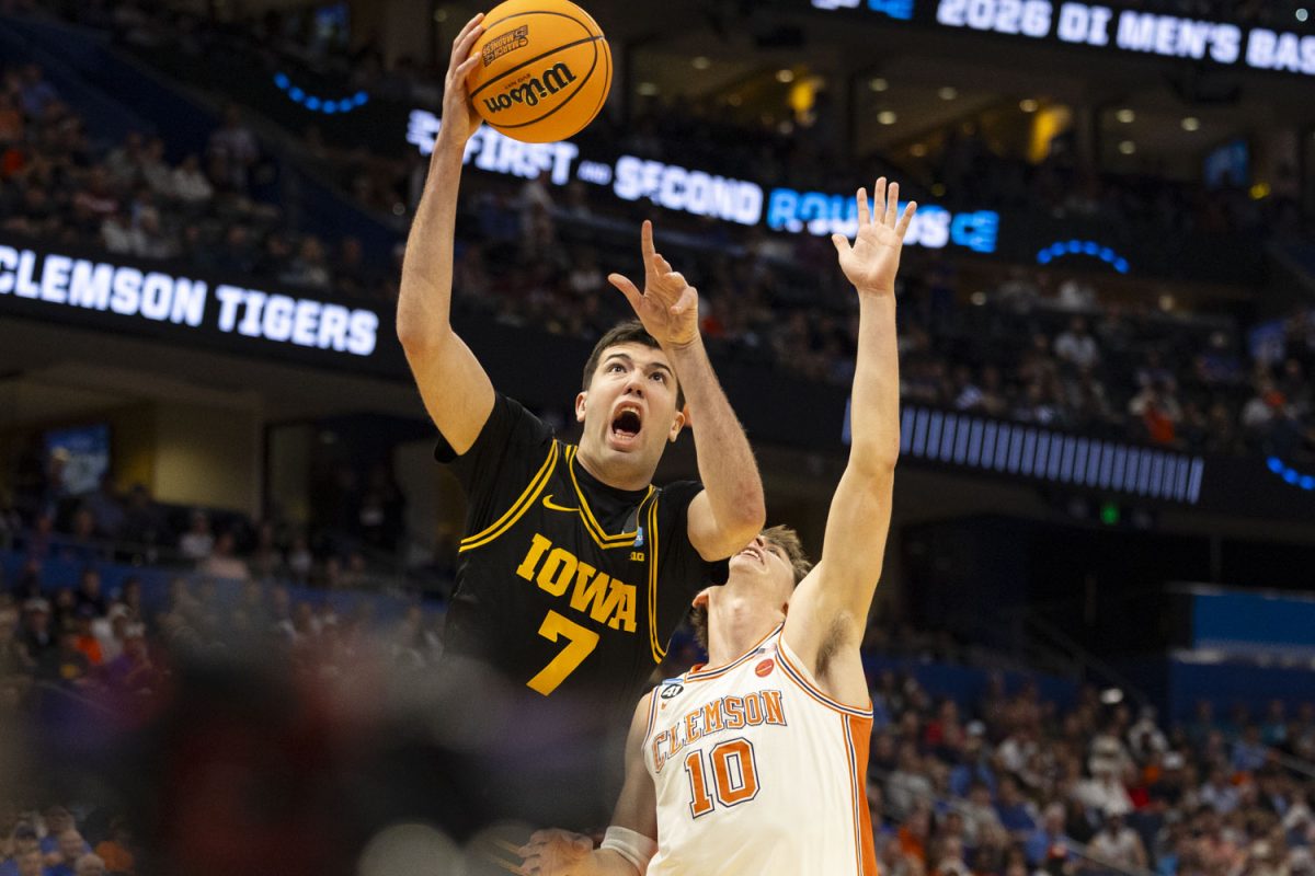 Clemson forward Jake Wahlin attempts to block a layup from Iowa forward Alvaro Folgueiras during a basketball game between the No. 9 seed Iowa Hawkeyes and the No. 8 seed Clemson Tigers at the Benchmark International Arena in Tampa, Florida on Friday, March 20, 2026. The Hawkeyes defeated the Tigers, 67-61. (Samantha DeFily/The Daily Iowan)