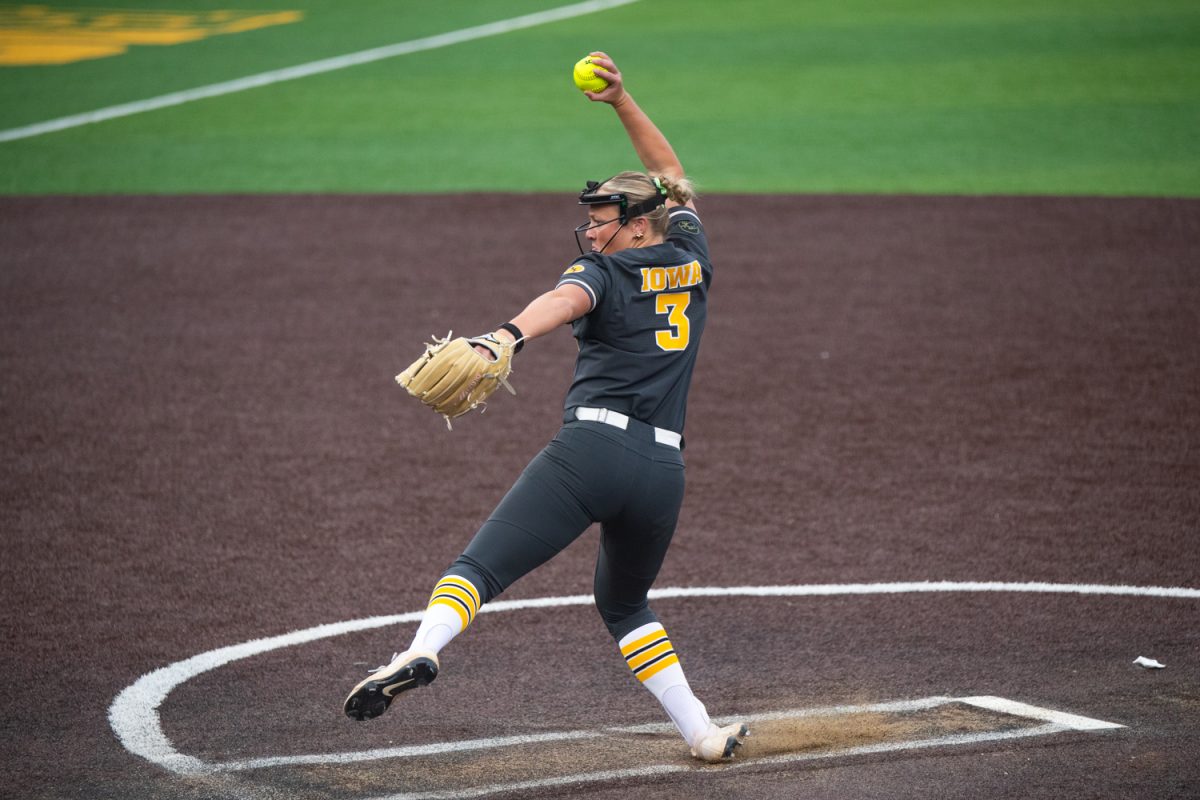 Iowa freshman right-hand pitcher Carly Brewer attempts a pitch in the game between the Iowa Hawkeyes and the Minnesota Gophers in Iowa City at Bob Pearl Field on Friday, March 20, 2026. This is the game opener for the Hawkeyes and their new head coach Stacy May-Johnson. The Gophers beat the Hawks 2-0 to start off the softball season. (Travis Crabb / The Daily Iowan)