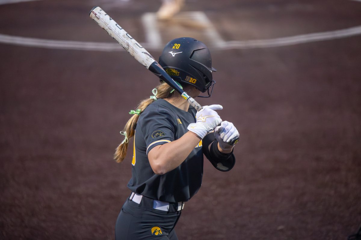 Iowa junior outfielder Devin Simon prepares for a pitch in a game between the Iowa Hawkeyes and the Minnesota Gophers in Iowa City at Bob Pearl Field on Friday, March 20, 2026. This is the game opener for the Hawkeyes and their new head coach Stacy May-Johnson. The Gophers beat the Hawks 2-0 to start off the softball season. (Travis Crabb / The Daily Iowan)