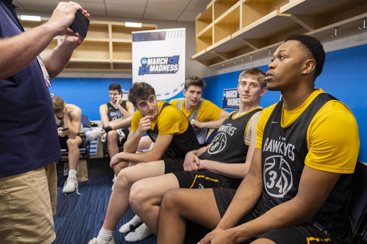 Iowa center Trevin Jirak, guard Tate Sage, and forward Cooper Koch watch as forward Cam Manyawu speaks with reporters during media availability with the No. 9 seed Iowa Hawkeyes and the No. 1 seed Florida Gators at the Benchmark International Arena in Tampa, Florida on Saturday, March 21, 2026. The Hawkeyes and Gators will face off on Sunday, March 22, at 6:10pm CST. (Samantha DeFily/The Daily Iowan)