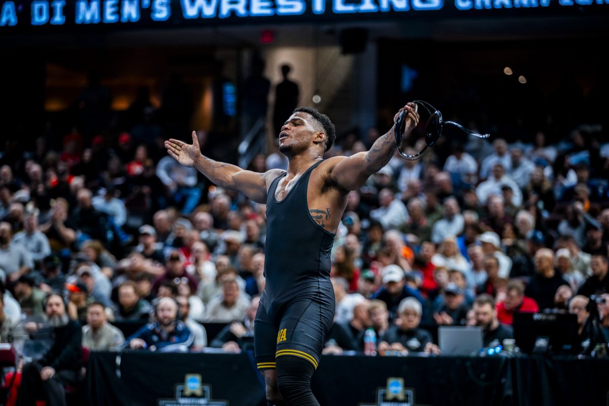 Iowa 197-pounder, Gabe Arnold celebrates seventh place finish over Maryland’s Branson John during session five of the NCAA Division I Wrestling Championships at Rocket Mortgage FieldHouse in Cleveland, Ohio on Saturday, March 21, 2026. Arnold defeated John by decision, 6-2. (Reece Schrader/Daily Iowan)
