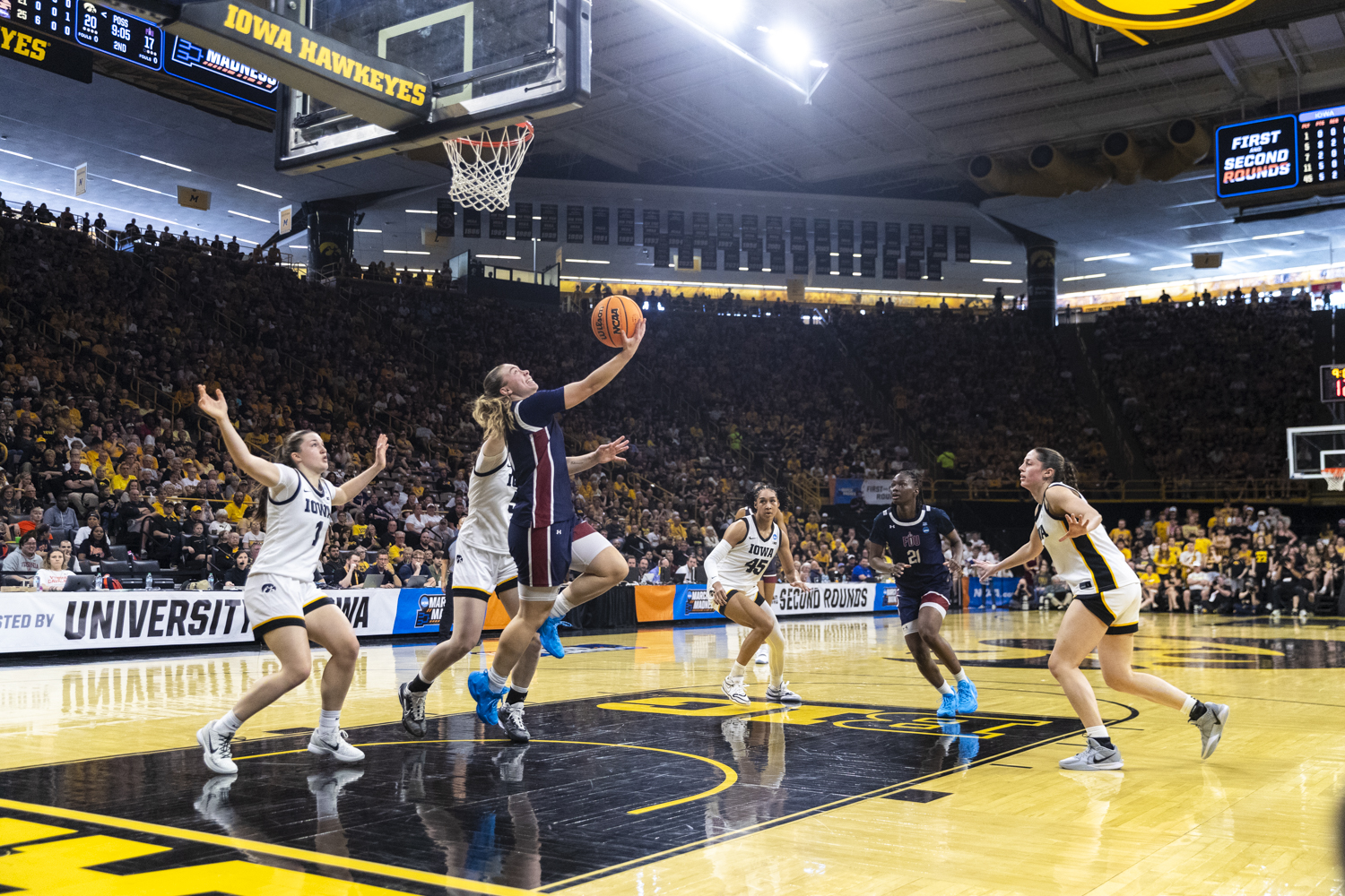 Fairleigh Dickinson Knights guard Ava Renninger (4) shoots a layup during a basketball game between the No. 2 seed Iowa Hawkeyes and the No. 15 seed Fairleigh Dickinson Knights at Carver-Hawkeye Arena in Iowa City, Iowa, on Saturday, March 21, 2026. The Hawkeyes defeated the Knights, 58-48. (Gabby Drees/The Daily Iowan)