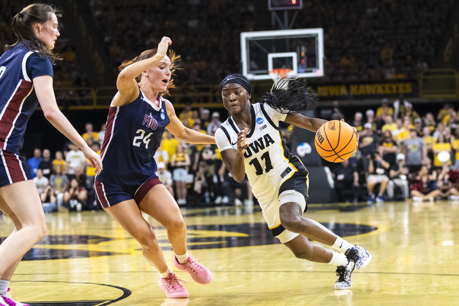 Iowa Hawkeyes guard Chazadi Wright (11) drives to the basket in the final seconds before the shot clock expires during a basketball game between the No. 2 seed Iowa Hawkeyes and the No. 15 seed Fairleigh Dickinson Knights at Carver-Hawkeye Arena in Iowa City, Iowa, on Saturday, March 21, 2026. The Hawkeyes defeated the Knights, 58-48. (Gabby Drees/The Daily Iowan)