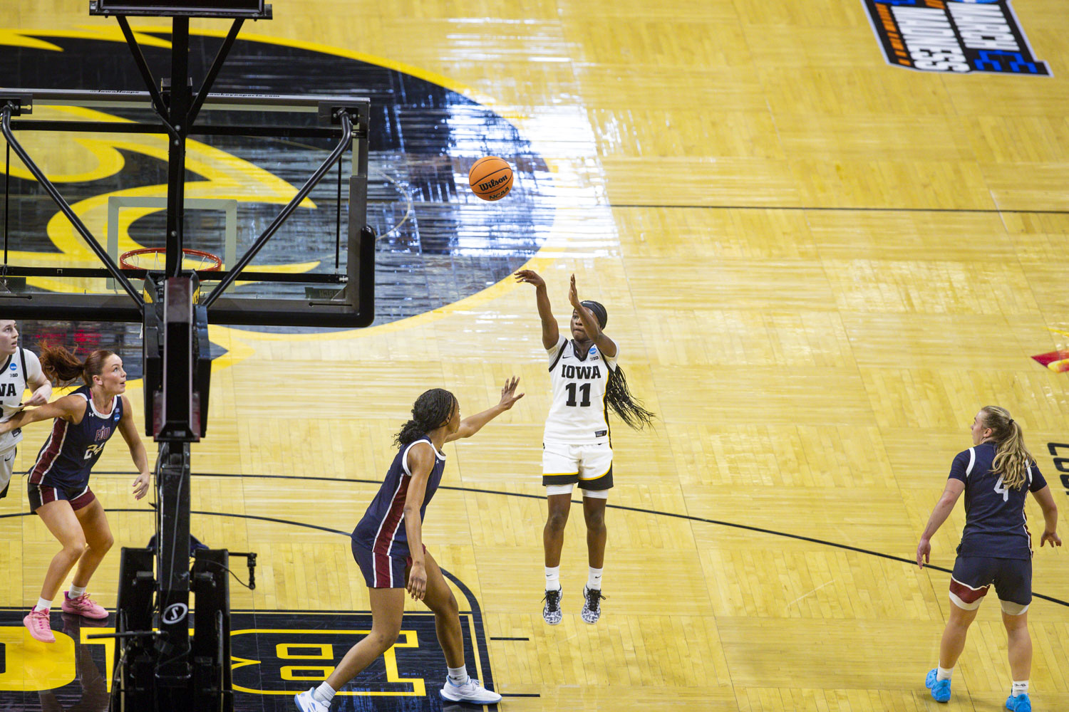 Iowa Hawkeyes guard Chazadi Wright (11) shoots the ball during a basketball game between the No. 2 seed Iowa Hawkeyes and the No. 15 seed Fairleigh Dickinson Knights at Carver-Hawkeye Arena in Iowa City, Iowa, on Saturday, March 21, 2026. The Hawkeyes defeated the Knights, 58-48. (Emma Calabro/The Daily Iowan)