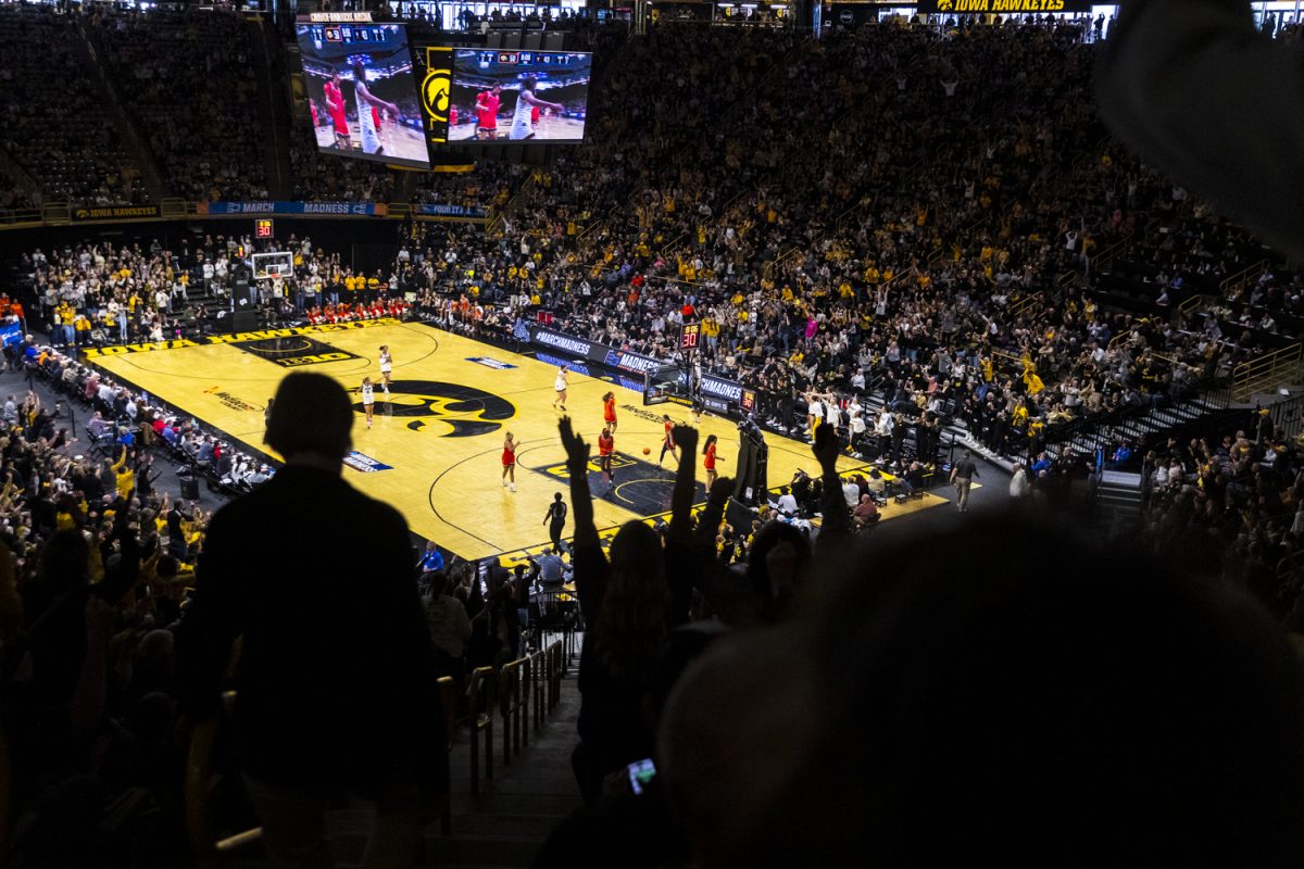 Fans cheer as Iowa scores during a second-round NCAA women’s basketball tournament game between the No. 2 seed Iowa Hawkeyes and the No. 10 seed Virginia Cavaliers at Carver-Hawkeye Arena in Iowa City on Monday, March 23, 2026. The Cavaliers defeated the Hawkeyes, 83-75.