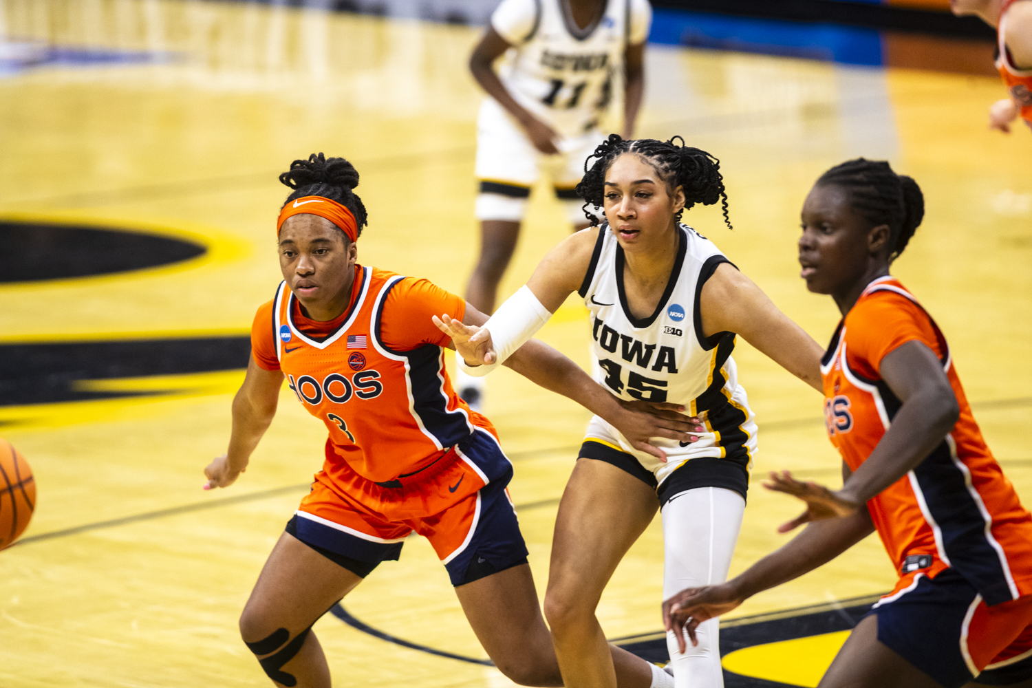 Virginia Cavaliers guard Gabby White (3) and Iowa Hawkeyes forward Hannah Stuelke (45) attempt to gain control of the ball during a second-round NCAA women’s basketball tournament game between the No. 2 seed Iowa Hawkeyes and the No. 10 seed Virginia Cavaliers at Carver-Hawkeye Arena in Iowa City on Monday, March 23, 2026. The Cavaliers defeated the Hawkeyes, 83-75.