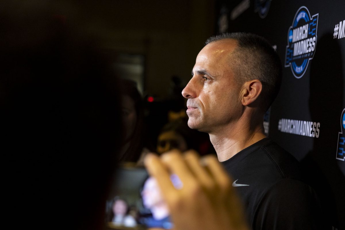 Iowa head coach Ben McCollum speaks with reporters during media availability with the No. 9 seed Iowa Hawkeyes and the No. 4 seed Nebraska Cornhuskers at the Toyota Center in Houston, Texas on Wednesday, March 25, 2026. The Hawkeyes and Cornhuskers will face off on Thursday, March 26, at 6:30pm CST. (Samantha DeFily/The Daily Iowan)