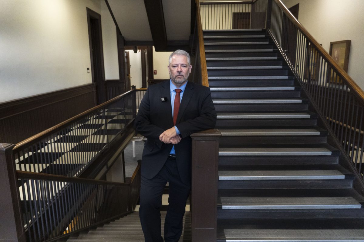 Luciano de Castro poses for a portrait in Calvin Hall in Calvin Hall on March 26. (Isabella Tisdale/The Daily Iowan)