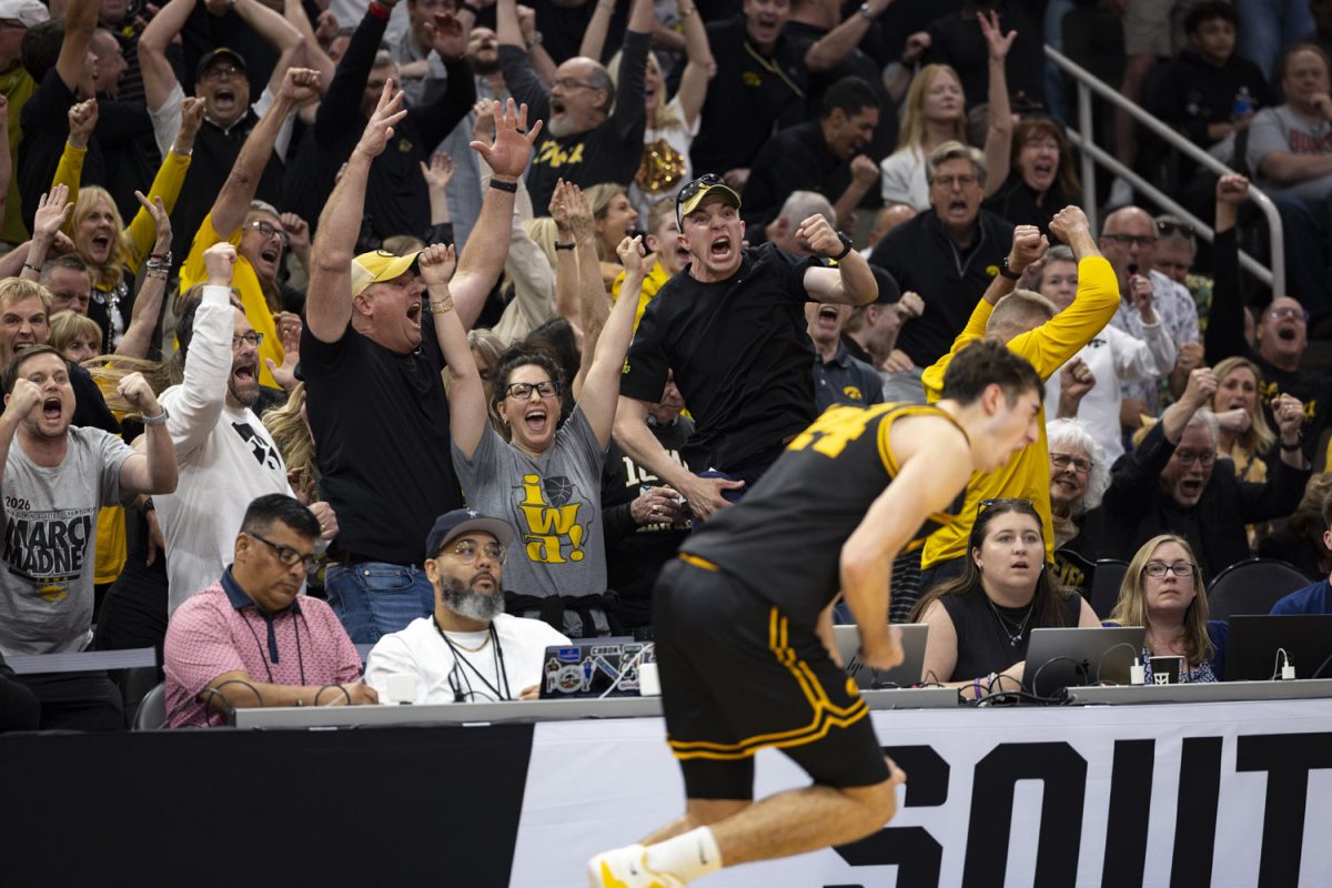 Iowa fans and guard Tate Sage celebrate during a basketball game between the No. 9 seed Iowa Hawkeyes and the No. 4 seed Nebraska Cornhuskers at the Toyota Center in Houston, Texas on Thursday, March 26, 2026. The Hawkeyes defeated the Cornhuskers, 77-71. (Samantha DeFily/The Daily Iowan)