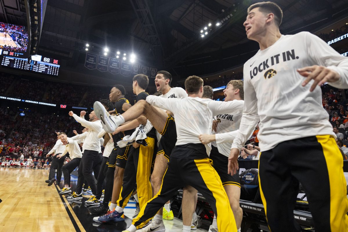 The Iowa bench celebrates during a basketball game between the No. 9 seed Iowa Hawkeyes and the No. 4 seed Nebraska Cornhuskers at the Toyota Center in Houston, Texas on Thursday, March 26, 2026. The Hawkeyes defeated the Cornhuskers, 77-71. (Samantha DeFily/The Daily Iowan)
