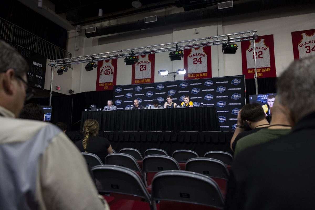 Iowa head coach Ben McCollum, guard Tavion Banks, forward Alvaro Folgueiras, and guard Bennett Stirtz speak with reporters during media availability with the No. 9 seed Iowa Hawkeyes and the No. 3 seed Illinois Fighting Illini at the Toyota Center in Houston, Texas on Friday, March 27, 2026. The Hawkeyes and Fighting Illini will face off on Saturday, March 28, at 5:09pm CST. (Samantha DeFily/The Daily Iowan)
