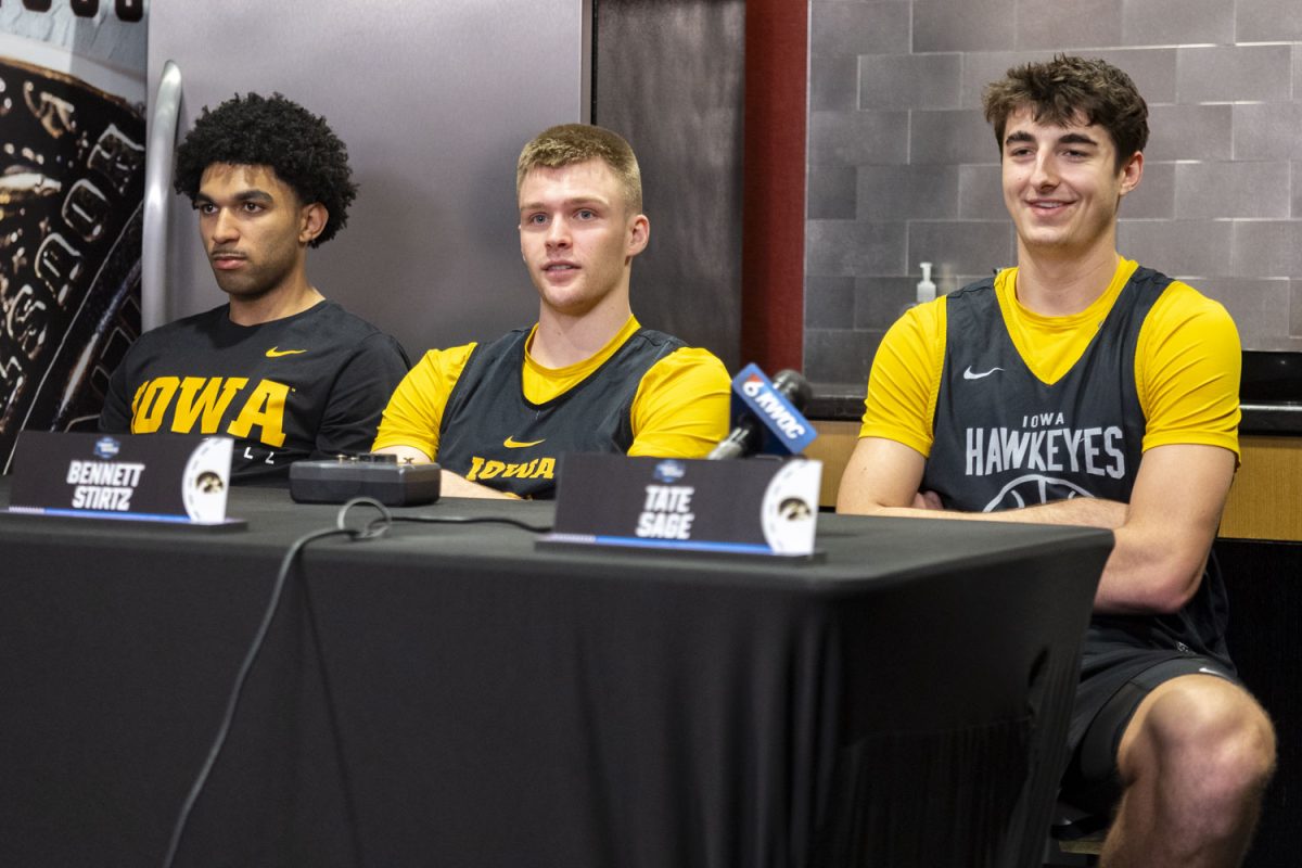 Iowa guards Kael Combs, Bennett Stirtz, and Tate Sage speak with reporters during media availability with the No. 9 seed Iowa Hawkeyes and the No. 3 seed Illinois Fighting Illini at the Toyota Center in Houston, Texas on Friday, March 27, 2026. The Hawkeyes and Fighting Illini will face off on Saturday, March 28, at 5:09pm CST. (Samantha DeFily/The Daily Iowan)
