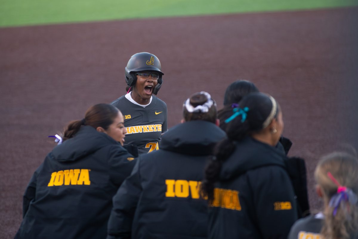 Iowa designated player Naiyln Marshall celebrates after she hit a home run at the softball game between Iowa and No. 16 Washington on Friday, March 27, 2026. Marshall had the only home run for Iowa in an attempt to match up with Washingtons fire power. The Huskies handed the Hawks their biggest defeat of the season so far with a 16-7 win over Iowa. (Travis Crabb/The Daily Iowan)