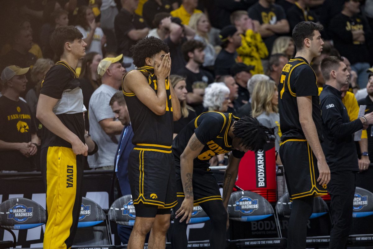 Iowa guard Kael Combs puts his face in his hands during a basketball game between the No. 9 seed Iowa Hawkeyes and the No. 3 seed Illinois Fighting Illini at the Toyota Center in Houston, Texas on Saturday, March 28, 2026. The Hawkeyes fell to the Fighting Illini, 71-59. (Samantha DeFily/The Daily Iowan)