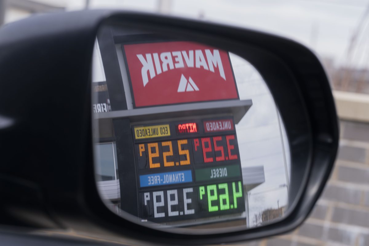 Gas prices are seen in the reflection of a car mirror at a Maverick gas station in Iowa City on Sunday, March 29, 2026. Gas prices have increased recently due to conflict with Iran. 