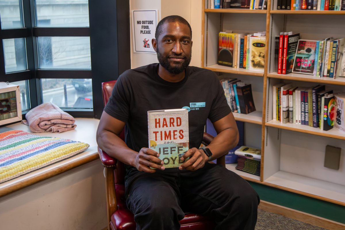 Jeff Boyd poses with his book at Prairie Lights in Iowa City, Iowa on Monday, March 30, 2026. (Andy Espineira/The Daily Iowan)