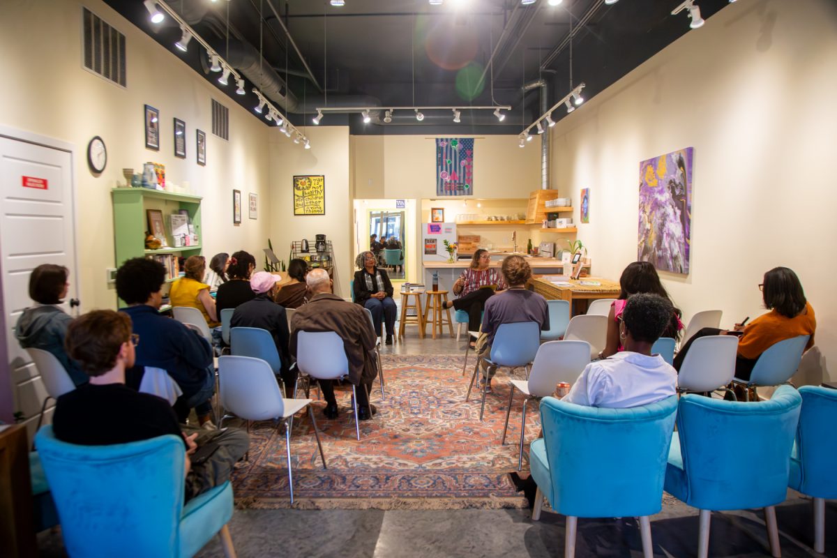 Attendees listen to Dr. Venise Berry and Dr. Janette Taylor at The Black Superwoman &amp; Mental Health event at Sacred Collective in Iowa City, Iowa on Tuesday, March 31, 2026. The event is discussing what the book is about more in depth. (Andy Espineira/The Daily Iowan)