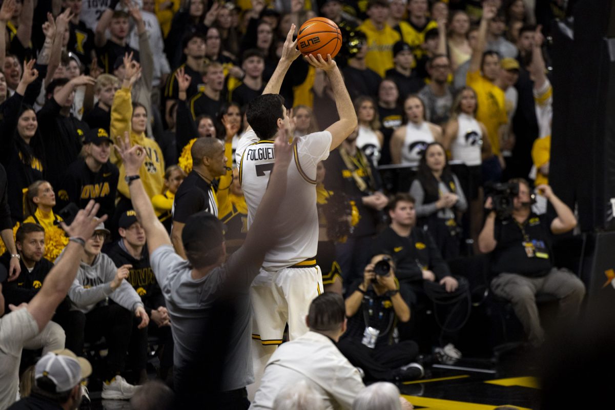 Iowa forward Alvaro Folgueiras shoots from beyond the arc during a men’s basketball game between the Iowa Hawkeyes and University of Michigan Wolverines at Carver-Hawkeye Arena on Thursday, March 5, 2026. The Wolverines defeated the Hawkeyes, 71-68.