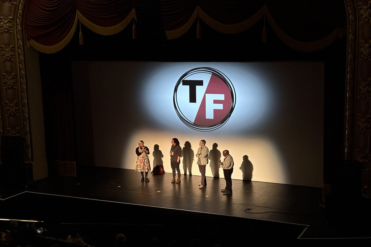 Producer Farihah Zaman stands alongside directors Stephen Maing and Eric Daniel Metzgar during a post-screening conversation to discuss their film "The Great Experiment" which premiered at True/False on March 6. The documentary is a collection of snapshots of political moments during President Donald Trump's first term. 