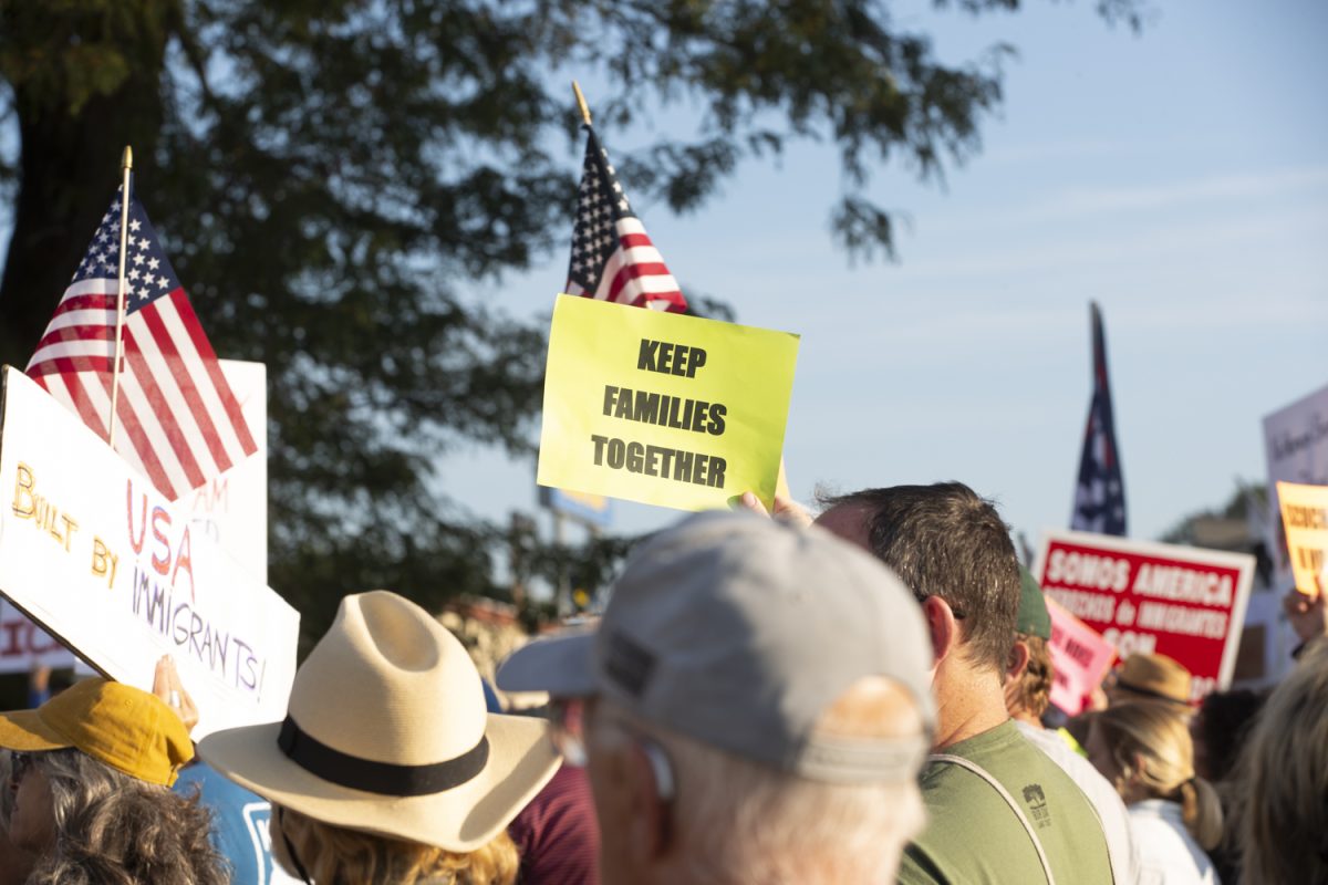 An attendee holds up a sign during a protest at the Department of Homeland Security’s Cedar Rapids office Tuesday, Sept. 2, 2025.