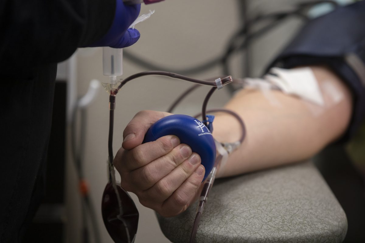 Kaitlyn Clark’s arm is seen while she donates blood at Impact Life in Coralville on Nov. 25, 2023. (Isabella Tisdale/The Daily Iowan)