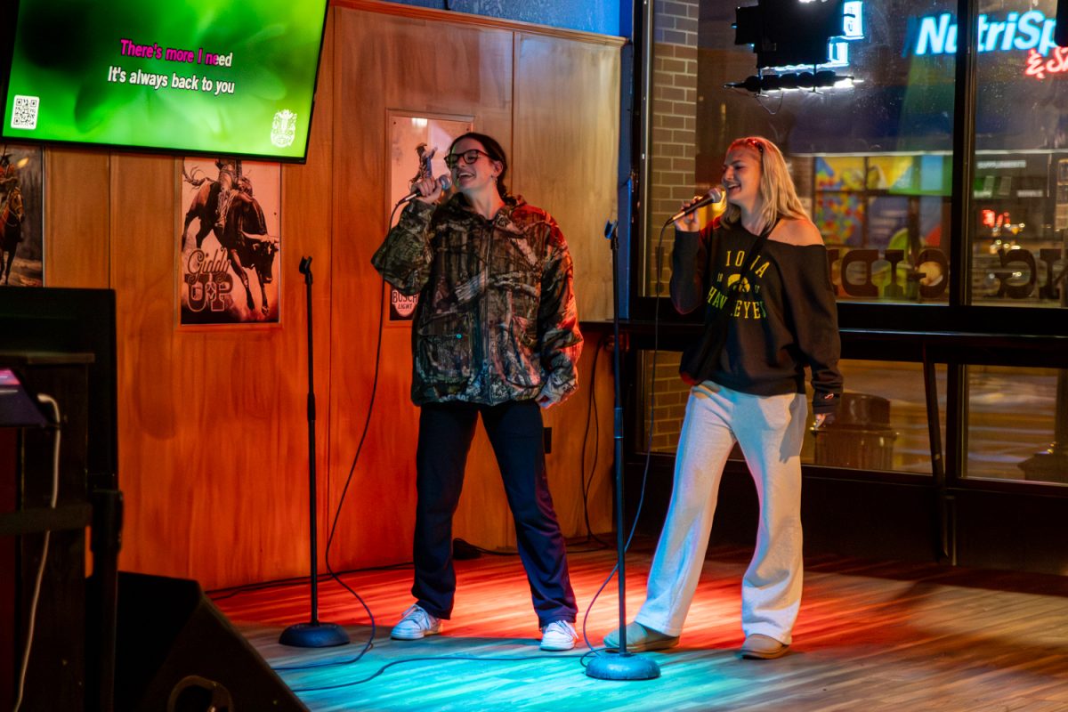 Patrons participate in karaoke at Giddy Up in Iowa City, Iowa on Wednesday, April 1, 2026. The bar hosts karaoke every Wednesday at 9pm. (Andy Espineira/The Daily Iowan)