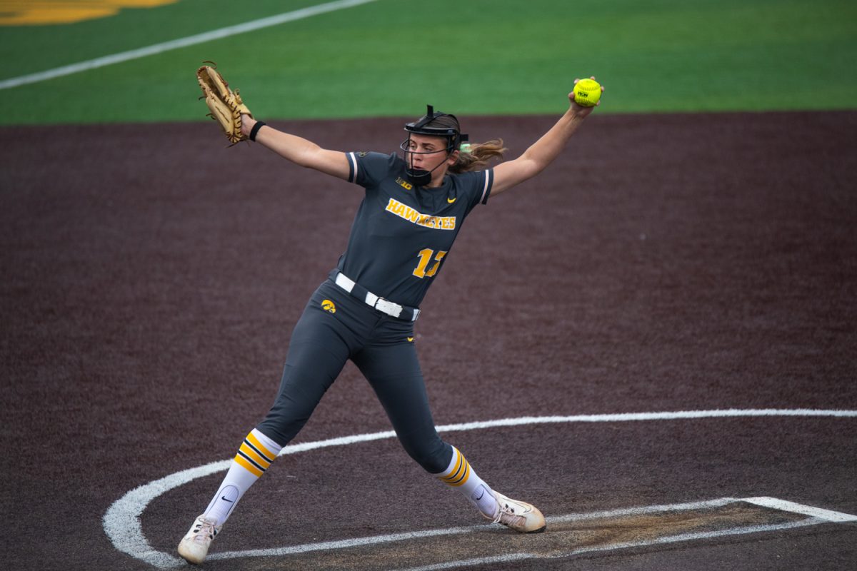 Iowa freshman left-hand pitcher Braylen Conlon attempts a pitch in the game between the Iowa Hawkeyes and the Minnesota Gophers in Iowa City at Bob Pearl Field on Friday, March 20, 2026. This is the game opener for the Hawkeyes and their new head coach Stacy May-Johnson. The Gophers beat the Hawks 2-0 to start off the softball season.