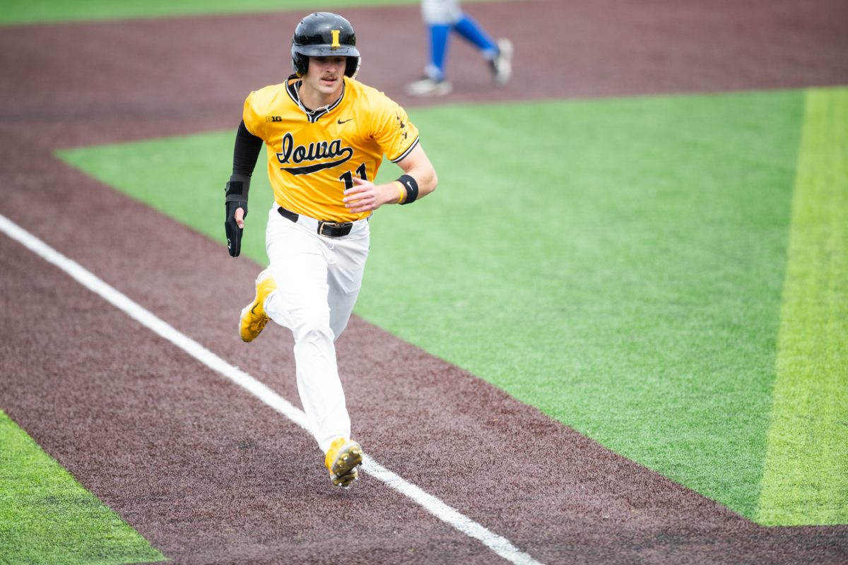 Iowa outfielder Miles Risley scores during a baseball game between the Iowa Hawkeyes and the #1 UCLA Bruins on Sunday, March 29, 2026. The Hawkeyes fell to the Bruins 14-6. (Patrick Murphy/The Daily Iowan)
