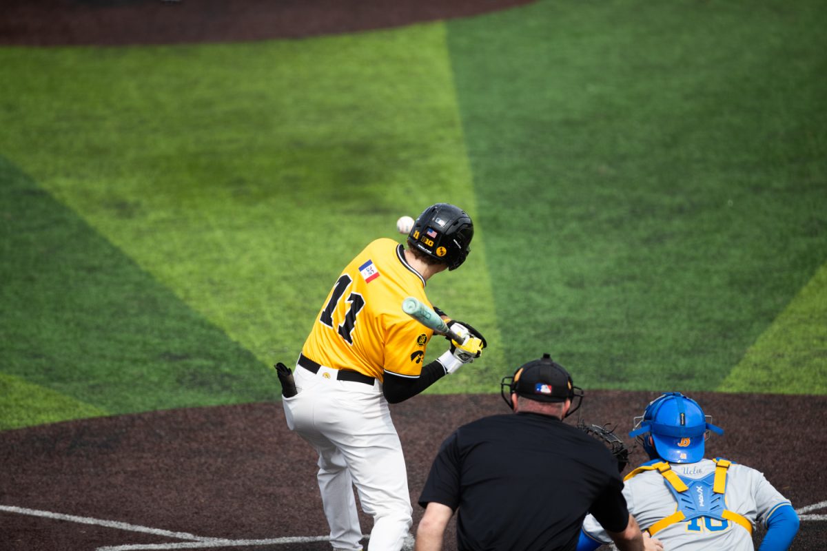 Iowa outfielder Miles Risley hits ball during a baseball game between the Iowa Hawkeyes and the #1 UCLA Bruins on Sunday, March 29, 2026. The Hawkeyes fell to the Bruins 14-6. (Patrick Murphy/The Daily Iowan)