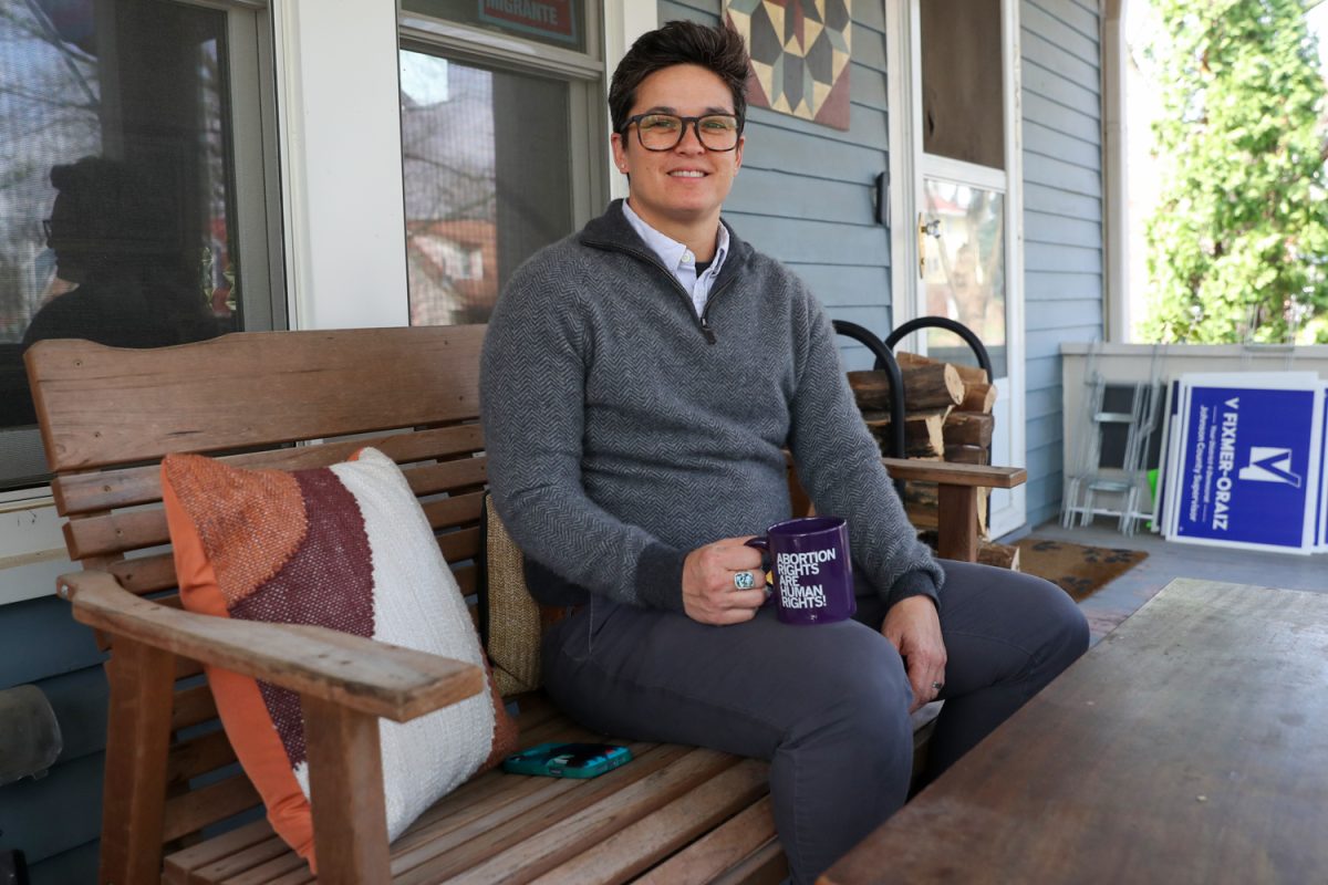 Supervisor V Fixmer-Oraiz poses for a portrait on their front porch in Iowa City on Thursday, April 2, 2026. Fixmer-Oraiz is running for reelection for the role of District 4, County Supervisor.(Travis Crabb / The Daily Iowan)