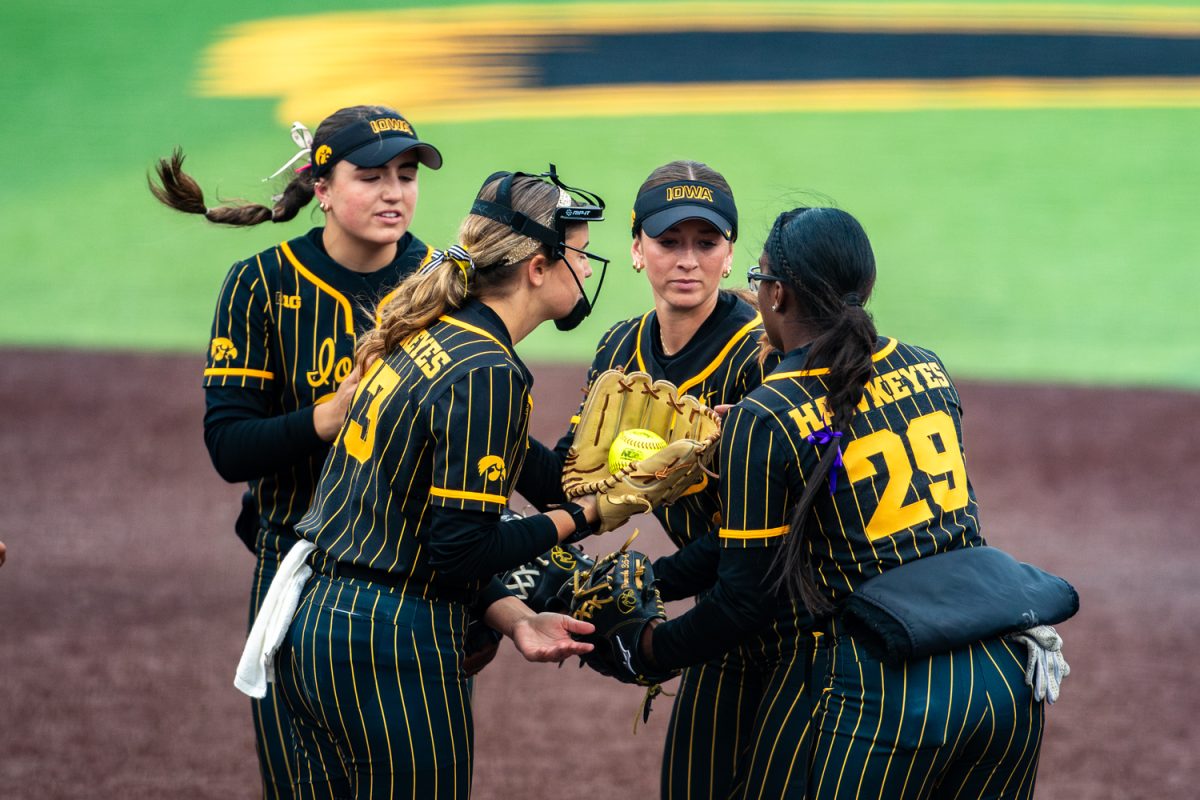 Iowa teammates huddle up after a  strikeout during a softball game between the Iowa Hawkeyes and the Georgia Tech Jackets at Bob Pearl Stadium in Iowa City, IA on Saturday, April 11th, 2026. The Jackets defeated the Hawkeyes 8-0 after an opening 2-1 loss on Friday, April 10th, 2026. (Reece Schrader/Daily Iowan)