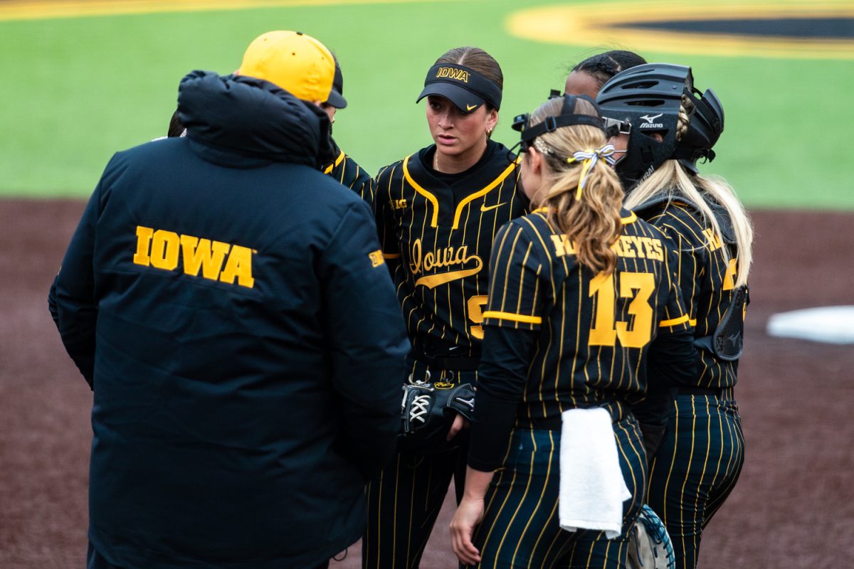 Iowa’s Kiara Sipe listens to her coach during a softball game between the Iowa Hawkeyes and the Georgia Tech Jackets at Bob Pearl Stadium in Iowa City, IA on Saturday, April 11th, 2026. The Jackets defeated the Hawkeyes 8-0 after an opening 2-1 loss on Friday, April 10th, 2026. (Reece Schrader/Daily Iowan)