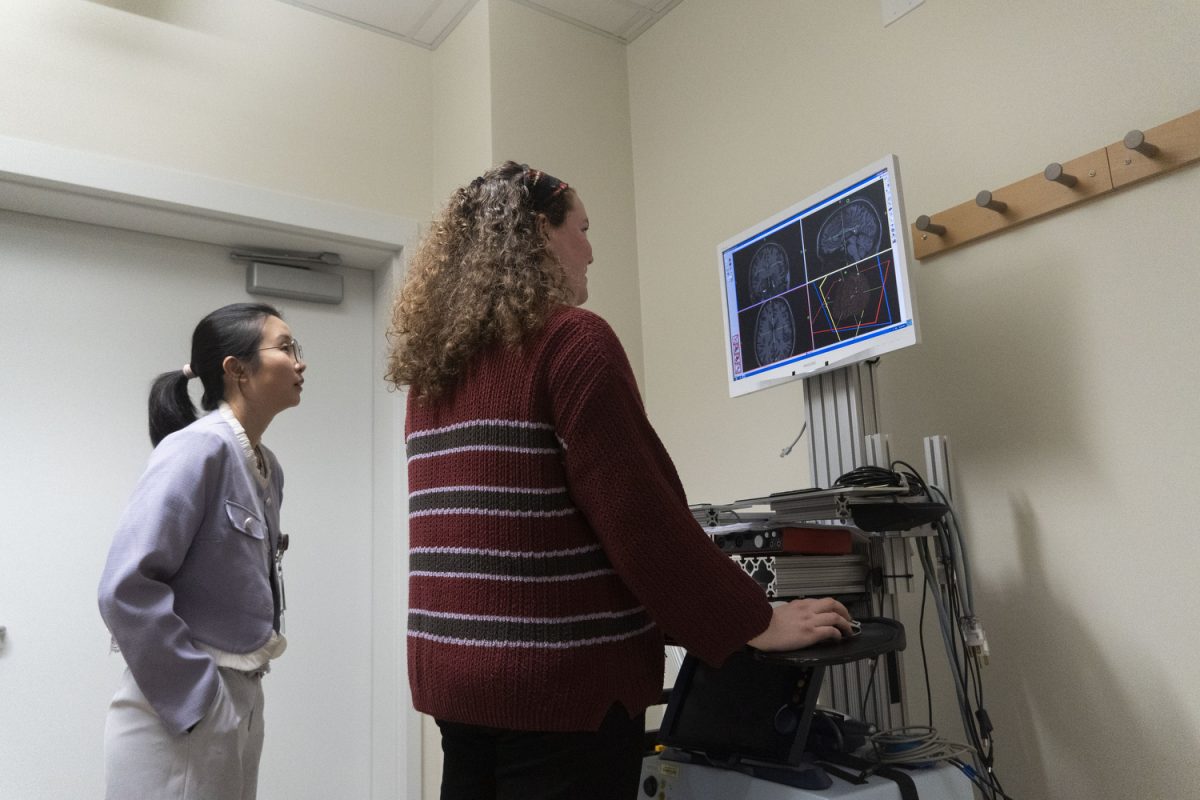 Jing Jaing and research assistant Emily Gittle look at brain scans at Pappajohn Biomedical Institute on Wednesday, April 15, 2026. 